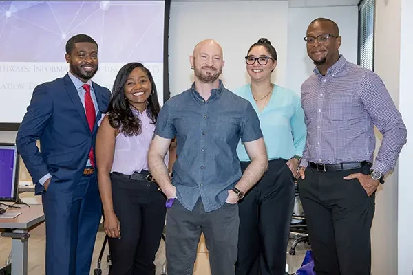 Diverse men and women of Montgomery college in professional attire